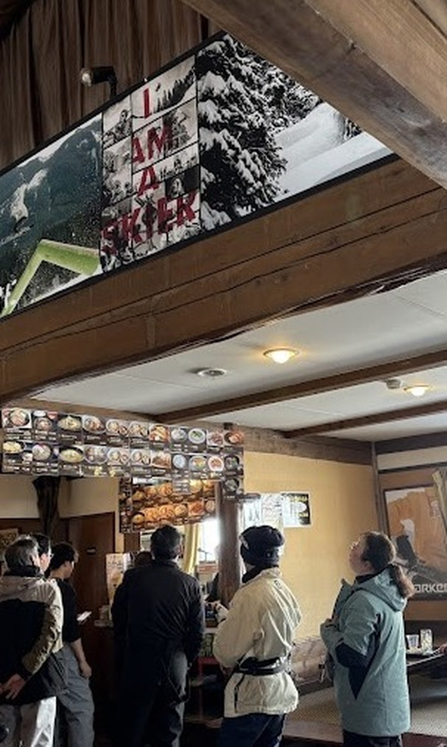 I AM A SKIER banner above the lodge counter at Wadagoya, Kagura